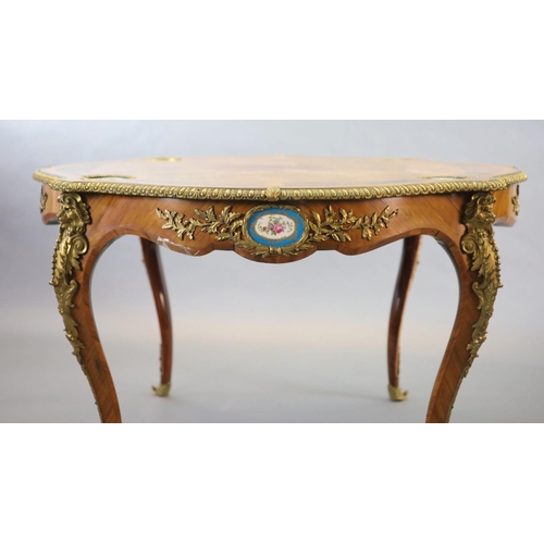 263 - A Victorian Louis XV style ormolu mounted walnut centre table,inset with Sevres style porcelain plaq... 