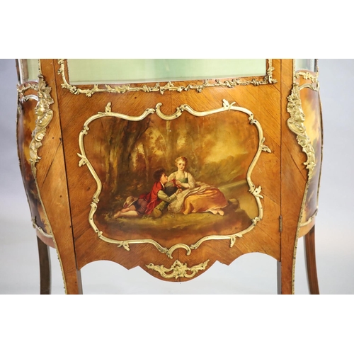 264 - A Louis XV style mahogany vitrine,of serpentine form with a shelved interior above vignettes painted... 