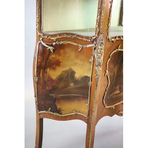 264 - A Louis XV style mahogany vitrine,of serpentine form with a shelved interior above vignettes painted... 