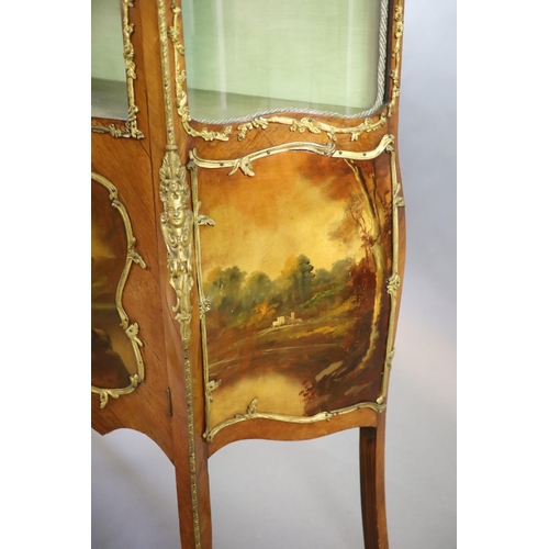 264 - A Louis XV style mahogany vitrine,of serpentine form with a shelved interior above vignettes painted... 