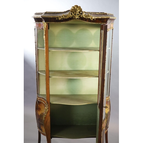 264 - A Louis XV style mahogany vitrine,of serpentine form with a shelved interior above vignettes painted... 