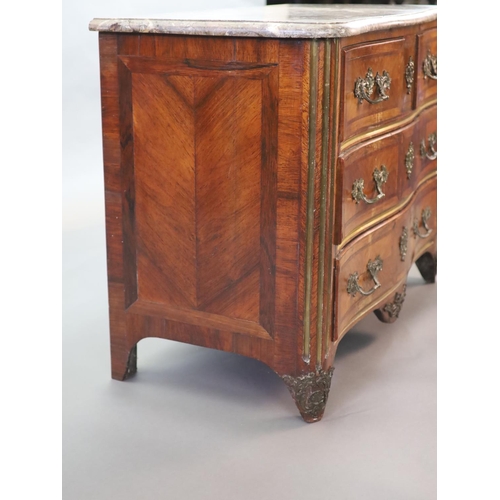 265 - A Louis XVI parquetry serpentine commode,with variegated grey marble top, two short and two long dra... 