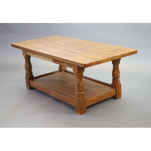 268 - A Thompson of Kilburn Mouseman oak 'refectory' coffee table,with rounded rectangular top on tapered ... 