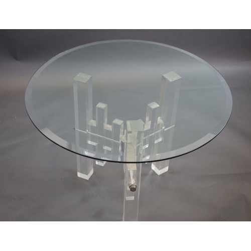 270 - A 1970's German glass top tablewith a heavy circular bevelled clear plate glass top raised on a clea... 