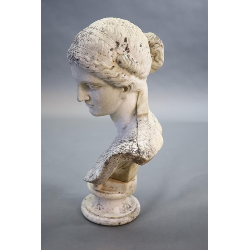 34 - A large weathered white marble bust of a Grecian maiden, 19th centuryraised on an associated socle b... 