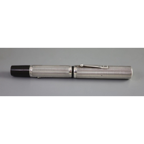 4 - A rare giant Waterman's 58 Ideal silver overlaid fountain pen,engine-turned with hallmarks for Londo... 