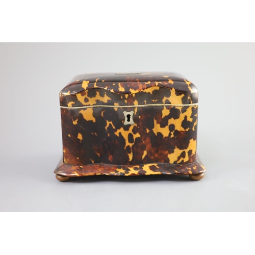 42 - A 19th century tortoiseshell tea caddy,of serpentine form, with a hinged cover and two interior lidd... 