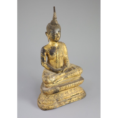 60 - A Thai gilt bronze seated figure of Buddha, 18th/19th century,seated in dhyanasana on a double lotus... 