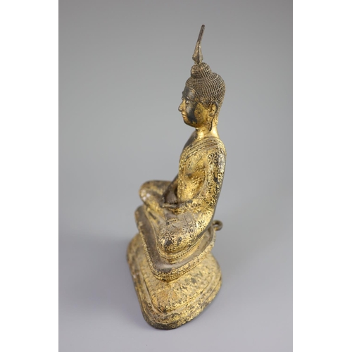 60 - A Thai gilt bronze seated figure of Buddha, 18th/19th century,seated in dhyanasana on a double lotus... 