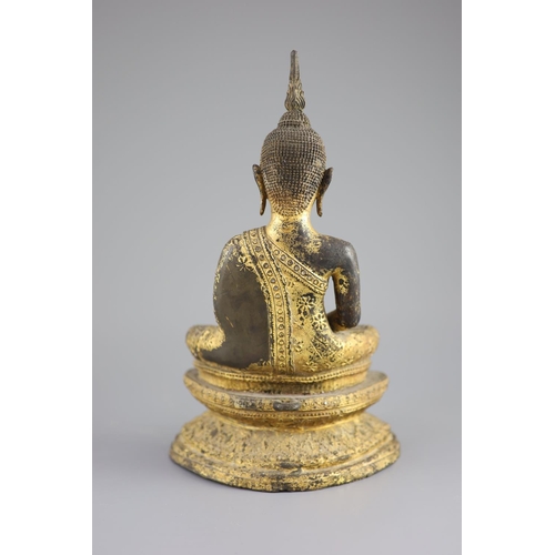 60 - A Thai gilt bronze seated figure of Buddha, 18th/19th century,seated in dhyanasana on a double lotus... 