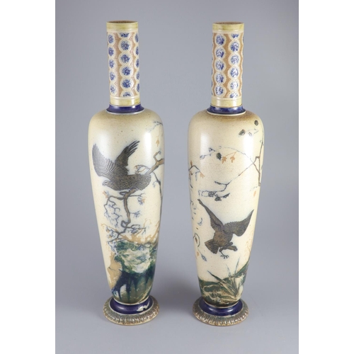 62 - A large pair of Martin Brothers 'eagle and vulture' stoneware vases, dated 1878,each decorated in s... 