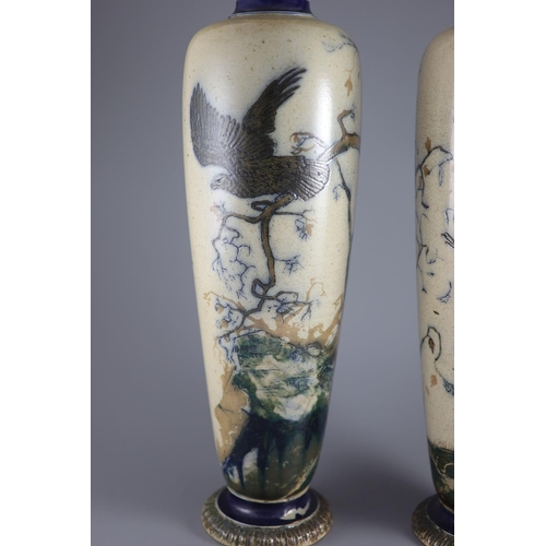 62 - A large pair of Martin Brothers 'eagle and vulture' stoneware vases, dated 1878,each decorated in s... 