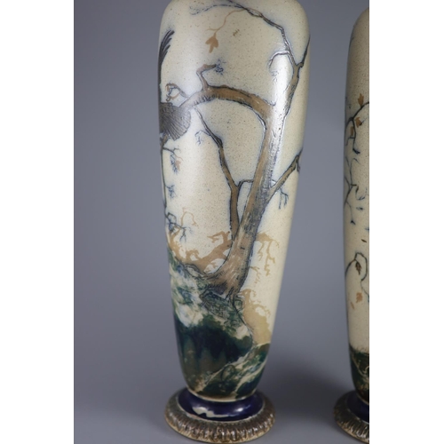 62 - A large pair of Martin Brothers 'eagle and vulture' stoneware vases, dated 1878,each decorated in s... 