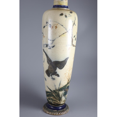 62 - A large pair of Martin Brothers 'eagle and vulture' stoneware vases, dated 1878,each decorated in s... 