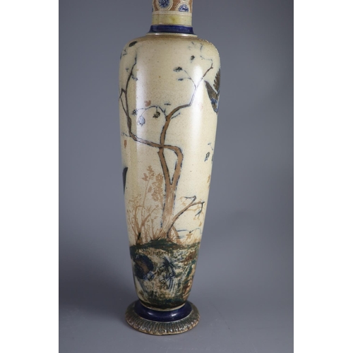 62 - A large pair of Martin Brothers 'eagle and vulture' stoneware vases, dated 1878,each decorated in s... 