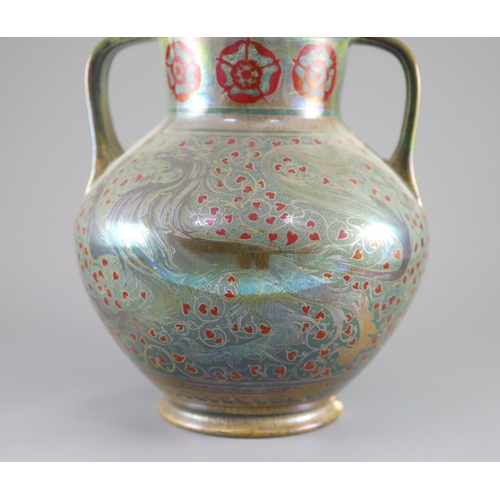 63 - A Pilkingtons Royal Lancastrian lustre two handled vase, by Gordon M. Forsyth,painted with heraldic ... 