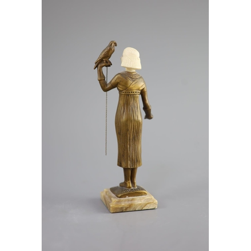 66 - Hélène Maynard White (American, b.1870). A bronze and ivory figure of an Egyptianesque girl, holding... 