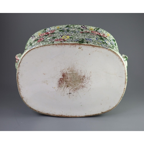 74 - A Victorian ironstone two handled footbath, c.1840,green printed and over enamelled with pink yellow... 