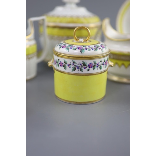 75 - A group of Derby yellow ground tea and coffee wares and a chamberstick, c.1790-1800,the sucrier and ... 