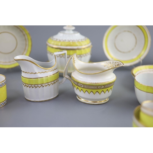 75 - A group of Derby yellow ground tea and coffee wares and a chamberstick, c.1790-1800,the sucrier and ... 