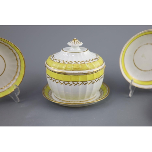 75 - A group of Derby yellow ground tea and coffee wares and a chamberstick, c.1790-1800,the sucrier and ... 