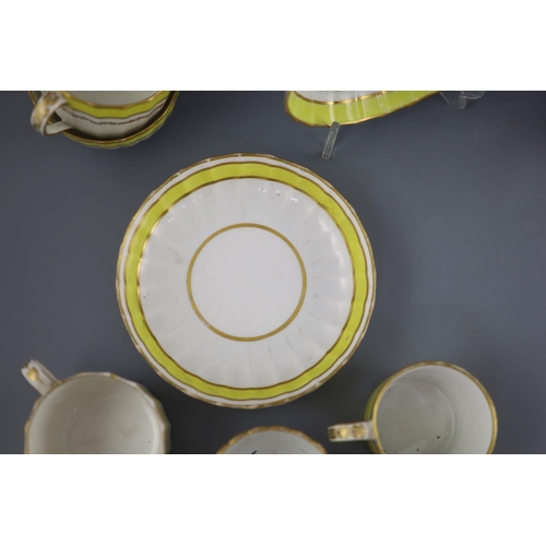 75 - A group of Derby yellow ground tea and coffee wares and a chamberstick, c.1790-1800,the sucrier and ... 