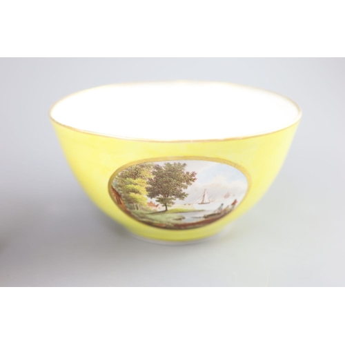 77 - A Derby yellow ground topographical slops bowl and a similar bough pot, c.1790-1800,the bowl painted... 