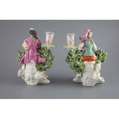 79 - A pair of Chelsea Derby musician candlestick figures, c.1770,the gentleman playing the bagpipes with... 