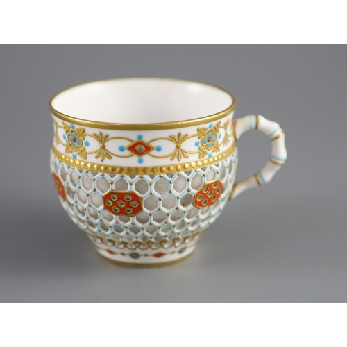 80 - A Royal Worcester 'jewelled' and reticulated cup and saucer, c.1870,decorated with raised jewelling ... 