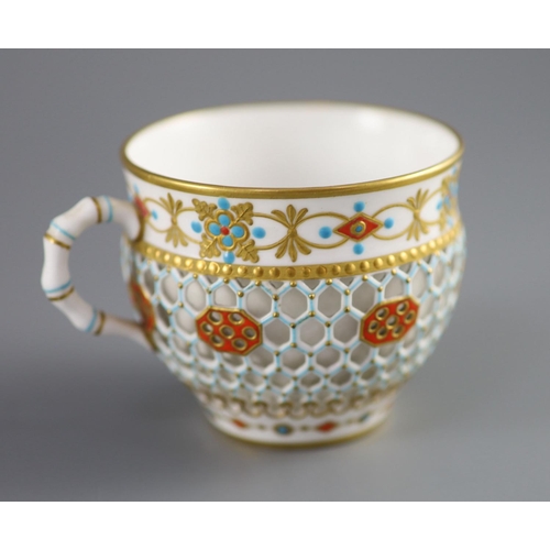 80 - A Royal Worcester 'jewelled' and reticulated cup and saucer, c.1870,decorated with raised jewelling ... 