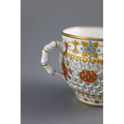 80 - A Royal Worcester 'jewelled' and reticulated cup and saucer, c.1870,decorated with raised jewelling ... 