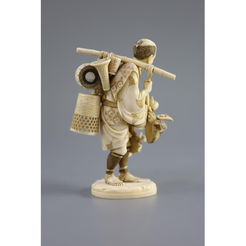 86 - A Japanese ivory okimono of a basket seller, early 20th centuryhis wares with polychrome inlay, two ... 