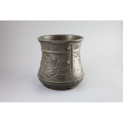 89 - A Japanese archaistic bronze two-handled vessel, Meiji periodcast in high relief with men hanging fr... 