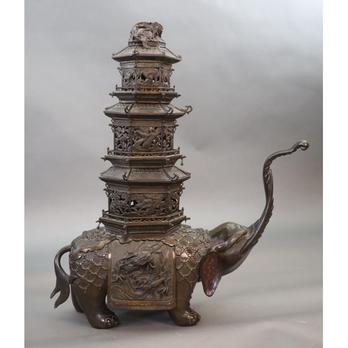 92 - An impressive Japanese bronze elephant koro, 19th century,modelled as a caparisoned elephant surmo... 