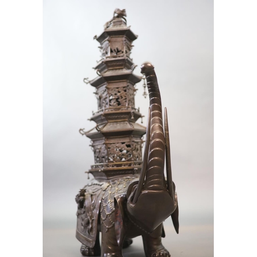 92 - An impressive Japanese bronze elephant koro, 19th century,modelled as a caparisoned elephant surmo... 