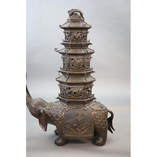 92 - An impressive Japanese bronze elephant koro, 19th century,modelled as a caparisoned elephant surmo... 