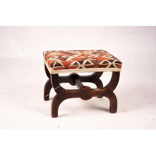 1061 - A Victorian beech 'X' framed stool with Kelim seat, length 48cm, depth 35cm, height 37cm... 
