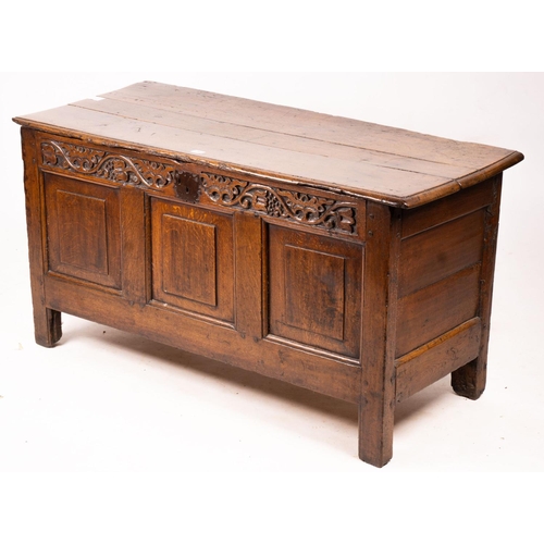 1064 - A 17th / 18th century carved oak coffer, length 132cm, depth 53cm, height 64cm