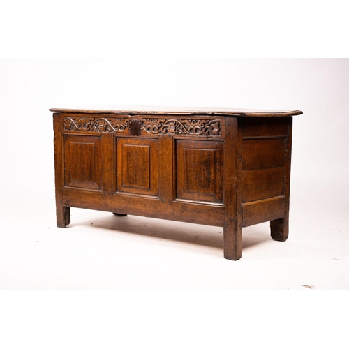 1064 - A 17th / 18th century carved oak coffer, length 132cm, depth 53cm, height 64cm