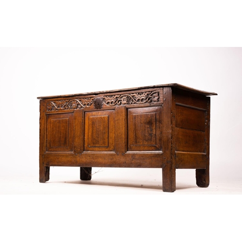 1064 - A 17th / 18th century carved oak coffer, length 132cm, depth 53cm, height 64cm