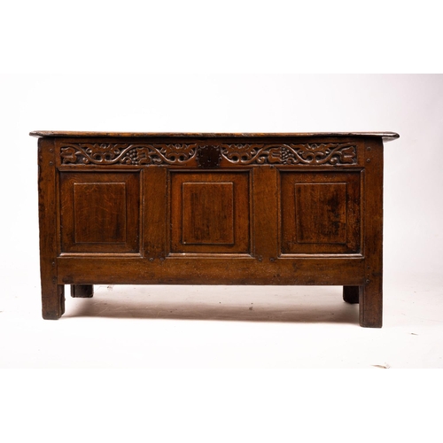 1064 - A 17th / 18th century carved oak coffer, length 132cm, depth 53cm, height 64cm