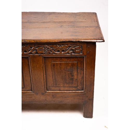 1064 - A 17th / 18th century carved oak coffer, length 132cm, depth 53cm, height 64cm