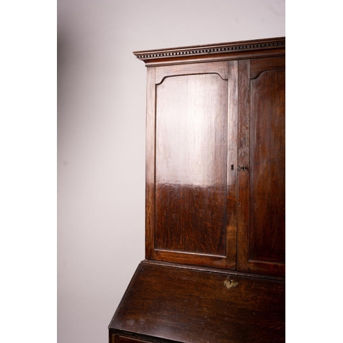 1069 - A George III oak bureau cabinet, width 108cm, depth 52cm, height 209cm