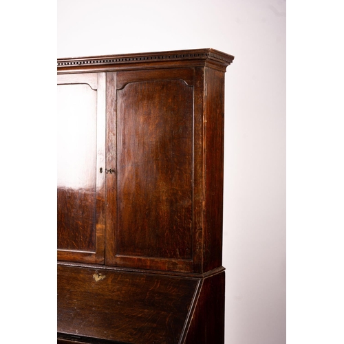 1069 - A George III oak bureau cabinet, width 108cm, depth 52cm, height 209cm