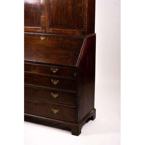 1069 - A George III oak bureau cabinet, width 108cm, depth 52cm, height 209cm