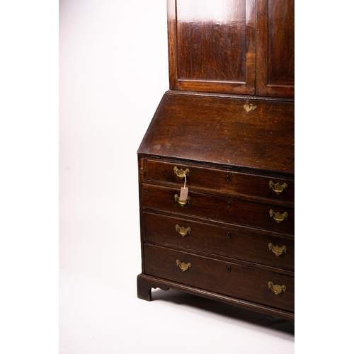 1069 - A George III oak bureau cabinet, width 108cm, depth 52cm, height 209cm