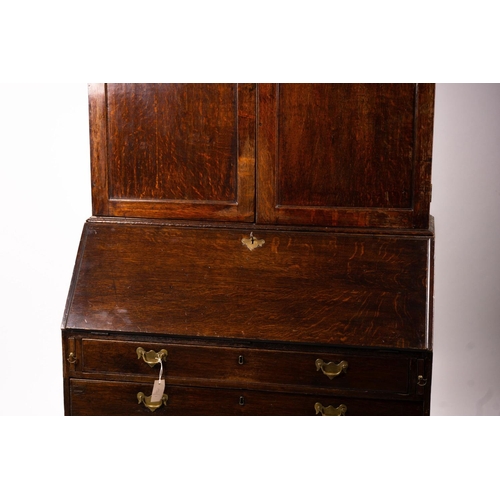 1069 - A George III oak bureau cabinet, width 108cm, depth 52cm, height 209cm