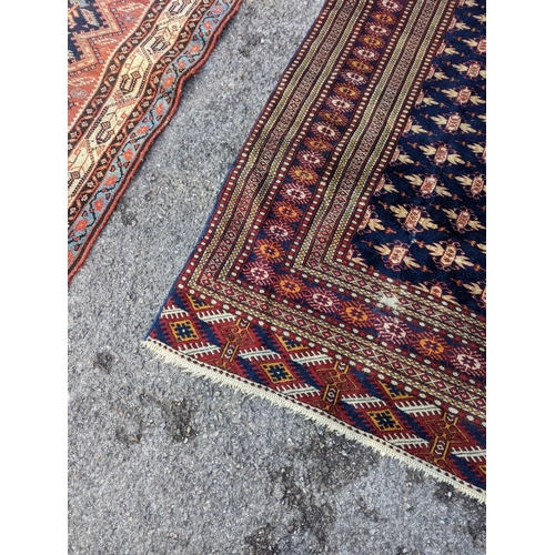 18 - A Bokhara blue ground rug, 191 x 126cm