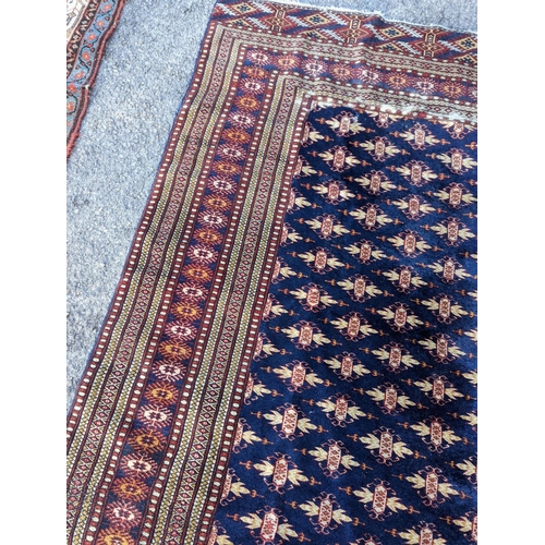18 - A Bokhara blue ground rug, 191 x 126cm
