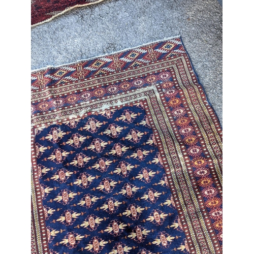 18 - A Bokhara blue ground rug, 191 x 126cm